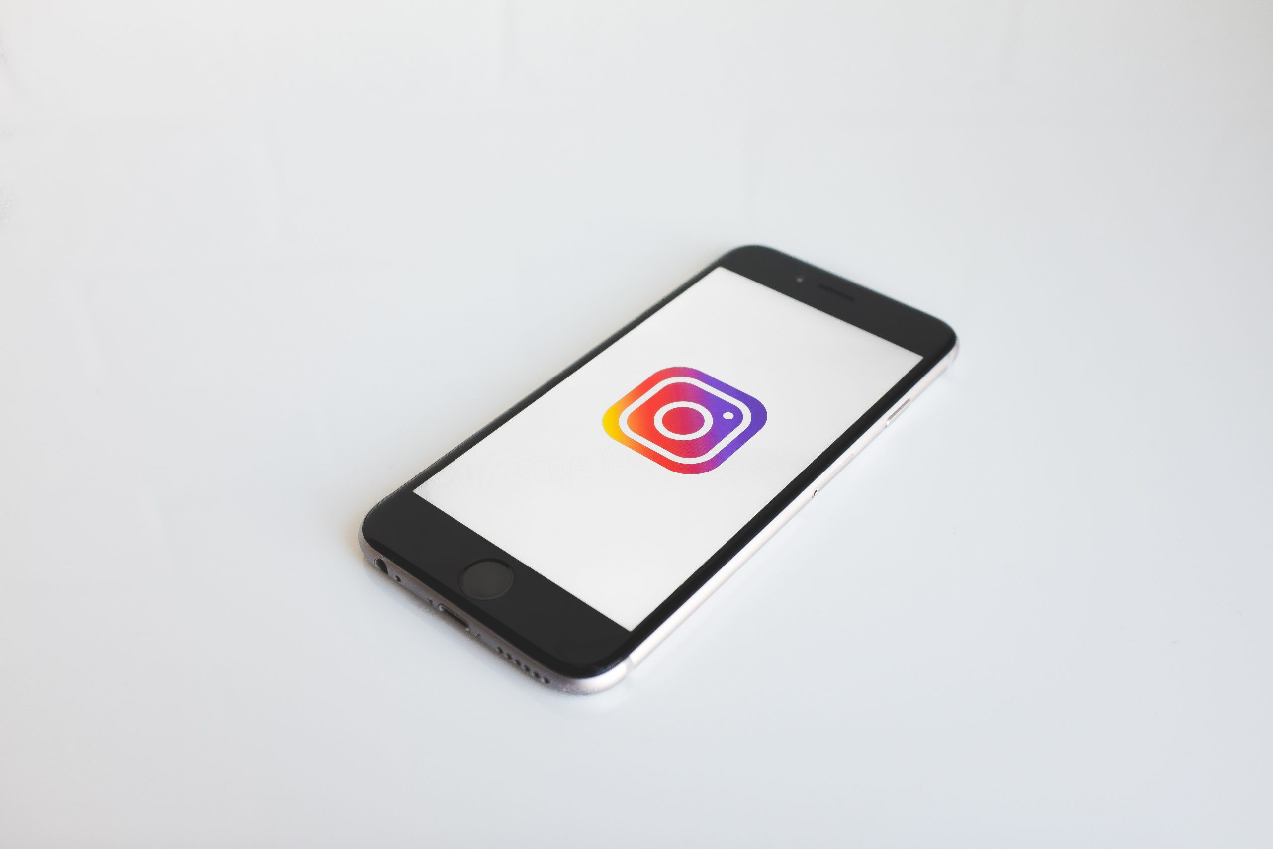 instagram logo on phone white background